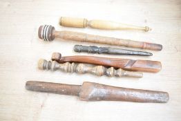 A collection of six 19th and 20th century turned and carved wooden knitting sticks, each of