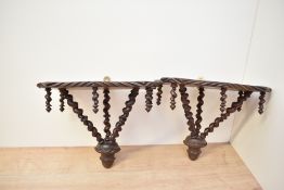Two 20th-century Japanese wooden wall brackets, featuring highly decorative twisted spiral-shaped