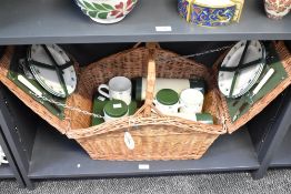 A large vintage Optima of West Sussex 4-person wicker picnic hamper, having section of olive-green