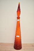 A tall 20th-century Italian Empoli glass genie bottle decanter, with a flame-shaped topper,