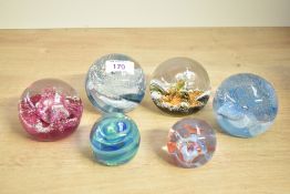 A selection of six 20th-century Caithness glass paperweights, to include 'Twirl', 'Debutante', '