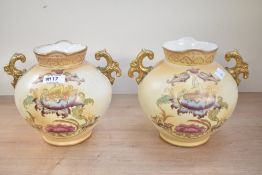 Two Victorian S. Fielding and Company pottery baluster vases with double gilded handles, renamed