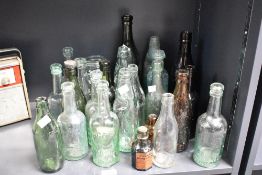 Of local interest, a selection of twenty four late 19th to early 20th-century glass Codd