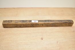 A 20th-century Chinese handcarved 'tianpeng ruler', having four-sides of carved Chinese characters