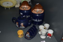 A pair of vintage Tetley tea storage jars labelled 'Cookies' sold alongside a Tetley tea teapot