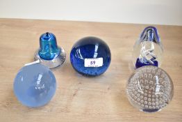 A quantity of blue 20th-century studio glass paperweights, to include a frosted glass etched world