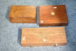 Three 20th-century wooden hinged lid boxes, to feature brass hardware with additional soft padding