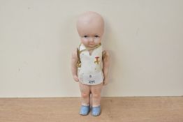 An early 20th-century hand-painted bisque jointed doll, featuring delicately painted facial features