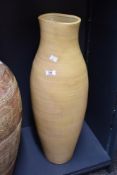 A tall contemporary floor-standing pottery-style vase, of baluster shape, featuring a simple,