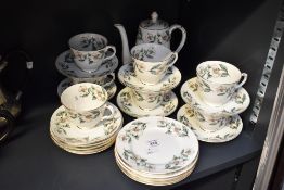 A 20th-century Crown Staffordshire fine bone china 'Christmas Rose' part tea set, featuring delicate