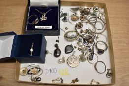 A collection of silver and white metal jewellery, including shell drop earrings, cultured pearl