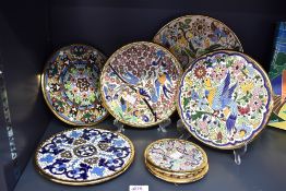 A quantity of late 20th-century to modern Spanish Sevillearte decorative plates, hand-painted in
