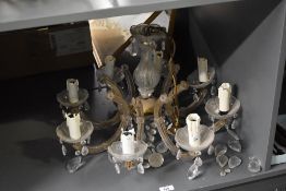 A large 20th-century French brass and glass 8-light pendant chandelier, having characteristics of