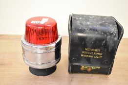 An early 20th-century Motorists Roto-Flasher warning light with original case, for a Rolls-Royce,