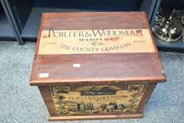 A large 20th-century Porter and Woodman Hamper crate, featuring illustrations of port, town and