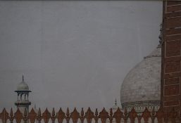 Pair of contemporary Indian prints, the first a street scene with bikes, the second the roof of a