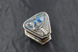 An Edwardian silver enamelled Art Nouveau pill box, of triangular form having a maiden in profile