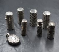 A group of eight Victorian silver scent bottles, one being cased, having embossed decoration, a