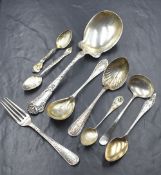 A 20th century American silver serving spoon, having floral decoration to the handle with 'G'
