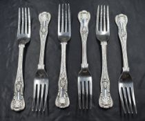 A group of five Victorian silver King's pattern forks, one having a heraldic crest, marks for London