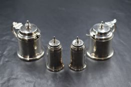 A pair of George V silver condiment pots, of circular form having step moulding, marks for London