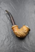 A white metal mounted Meerschaum pipe, having a carved country scene and scrollwork and white