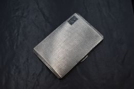 A George VI silver cigarette case, of hinged rectangular form having engine turned decoration and '