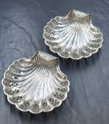 A pair of Victorian silver shell dishes, of scalloped form having pierced decoration, marks for