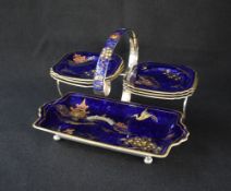 A 20th century silver plated sandwich plate cruet set, the frame having Chinese motif enamel to