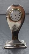 An early 20th century silver mounted desk clock, of balloon shape having 'RMC' monogram and 'Oct