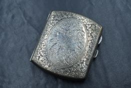 A George VI silver cigarette case, of hinged rectangular form having decorative scroll work with '