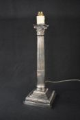 An impressive 20th century silver plated lamp, having a Corinthian column design on a six step base,