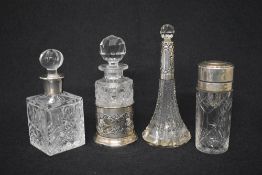 A late Victorian silver cased glass scent bottle, of cylindrical form, having cherubs and scroll