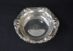 A 19th century American silver bowl, having a lobed rim with relief summer fruit decoration,