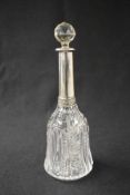 A 20th century Polish white metal 800. grade mounted glass decanter, of mallet form having a