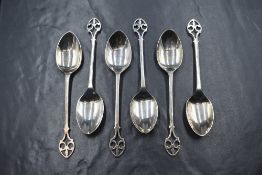 A cased set of six George V silver teaspoons having decorative pierced terminals, marks for