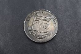 A George VI silver medallion, for the Windermere Grammar School, engraved 'W.A.DOBSON 1939 FIRST