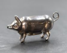 A silver novelty vesta case, in the form of a pig with a hinged head and match striker to the