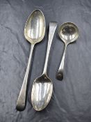 A George III silver Old English pattern serving spoon, having 'IHB' to terminal, marks for London