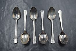 A cased set of six Elizabeth II silver teaspoons, having engine turned decoration, marks for