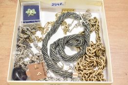 A small collection of costume jewellery, including neck chains, 'F' gold plated stud earrings and