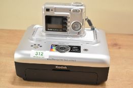 A Kodak Easyshare C330 camera and Easyshare Print Dock 3 in a camera bag with cables, booklets etc