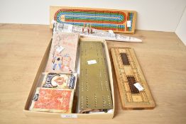 A collection of late 20th-century to modern cribbage boards, which are used to keep score in the
