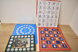 A selection of 20th-century reproductions coins and badges; to include British regimental badges;