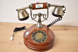 A 1930's style Steepletone SNW17 Nostalgia vintage style desktop corded telephone with wooden body.