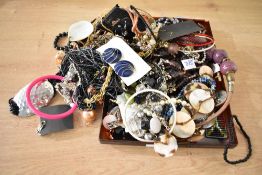 A collection of costume jewellery, including bangles, beaded jewellery, paste set pieces and drop