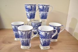 A set of seven Millennium Ringtons Fine Bone China beakers, illustrated in blue and white with