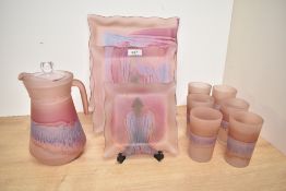 A frosted glass pitcher decorated in purple and blue iridescent patterns, h21cm, sold together