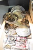 Four vintage cast iron and glass lenses sold along with two pairs of vintage model wheels and a