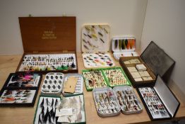 A Large collection of salmon and trout flies in several storage and pocket boxes